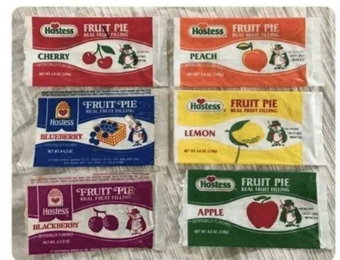 A display of six vintage Hostess Fruit Pies with various fruit fillings, reminding you how old you are.
