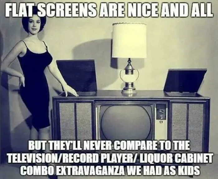 A woman stands next to a vintage television, record player, and liquor cabinet combo that might take you way back.