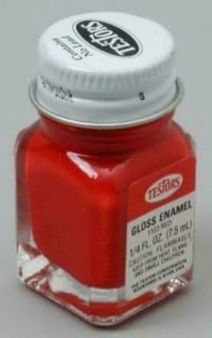 Small red Testors gloss enamel paint bottle, 1/4 fl. oz., evokes memories for those who remember how old you are.