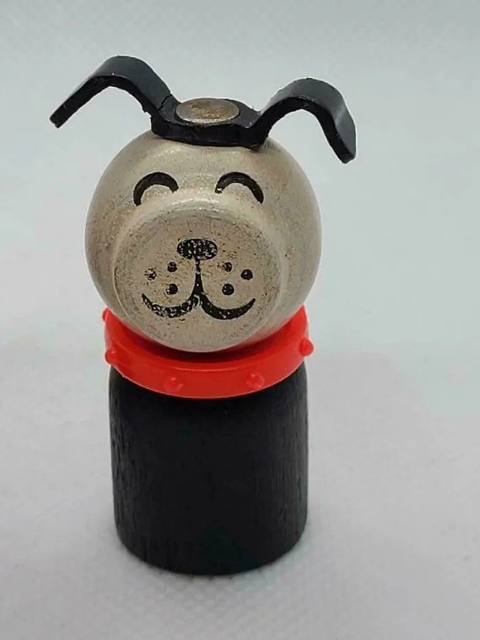 A vintage wooden dog toy with a red collar, reminding you how old you are with this classic item.