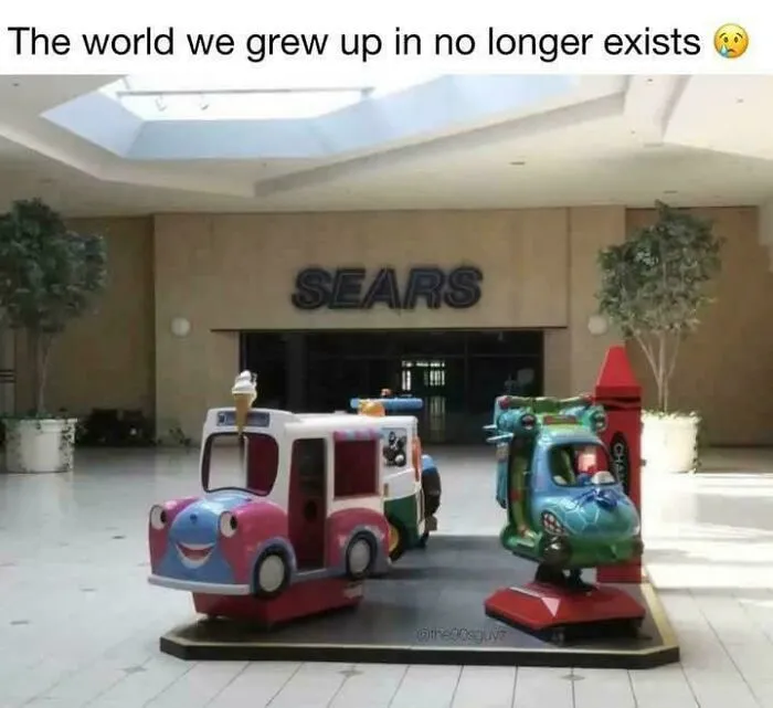 Empty mall area with vintage kid ride-on toys outside a closed Sears store, evoking 90s nostalgia and childhood memories.