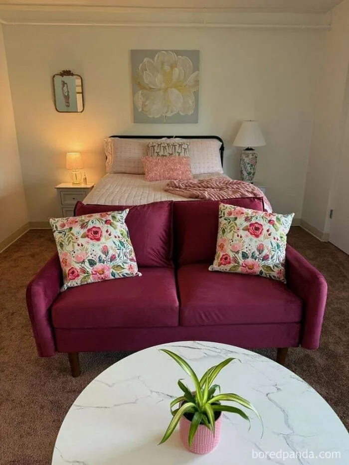 Cozy bedroom with floral pillows and warm lighting creating a wholesome atmosphere