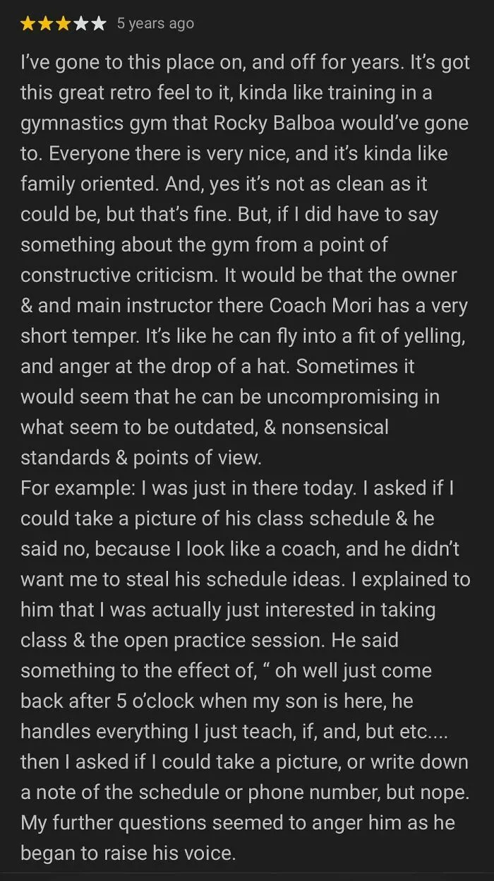 Five-star customer review showing a delusional attempt to settle issues via reviews with complaints about gym instructor behavior.
