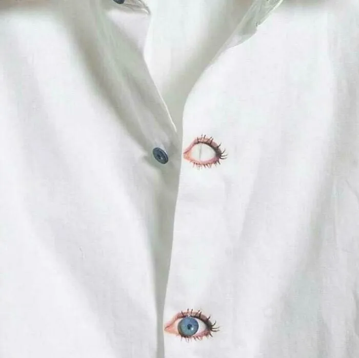 White shirt with buttons designed as realistic eyes
