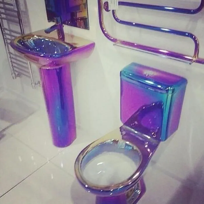 Weird concept of iridescent metallic toilet and sink set