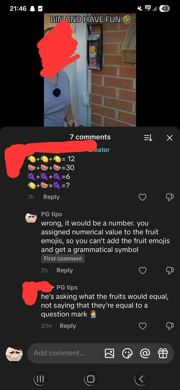 A comment thread on a fruit emoji math puzzle where a user corrected an obvious joke about a question mark.