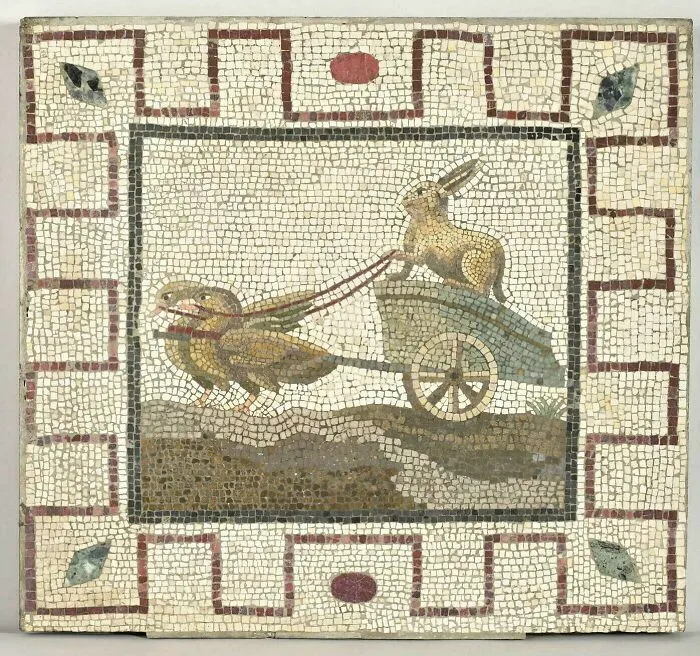 An Ancient Roman Mosaic Depicting A Rabbit Driving A Chariot Pulled By Geese. Now Housed At The Louvre Museum
