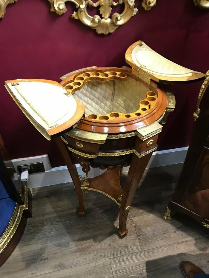 What Would You Call This Three-Footed Opening Furniture With Padded Interior?