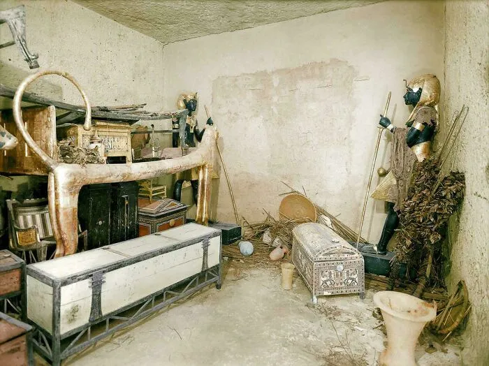 Ancient artifacts including statues and chests displayed in a historic room showcasing humanity's preserved heritage.