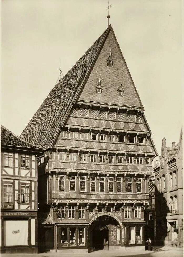 Historic artefact of medieval timber-framed building with intricate patterns and steep roof surviving to this day.
