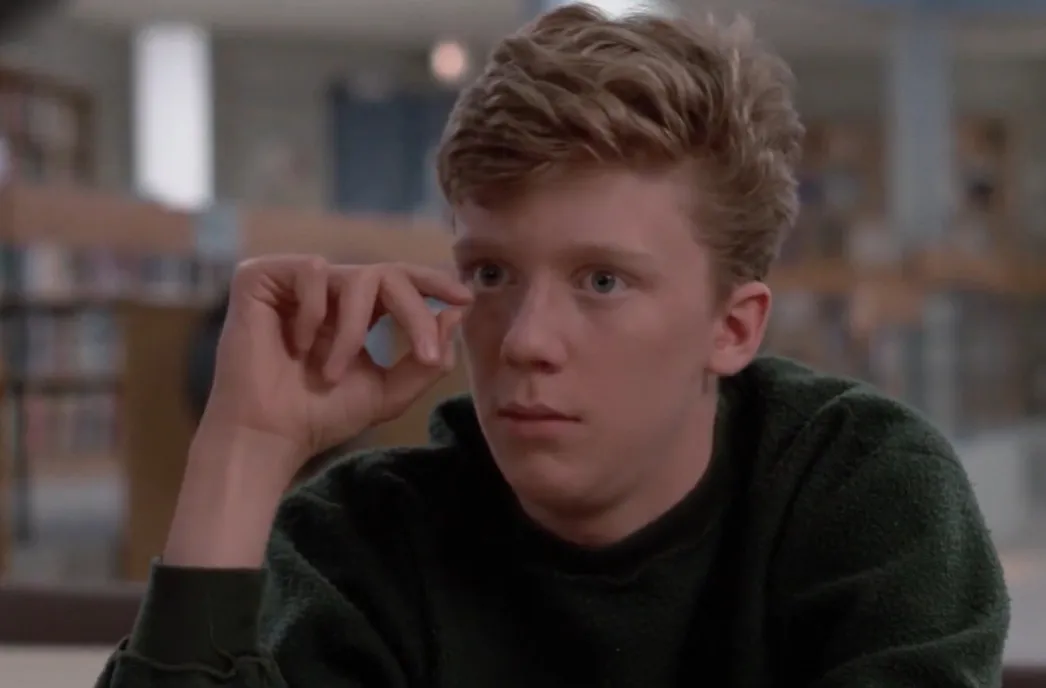 Brian from The Breakfast Club looking thoughtful, representing which character would write this rant about school and life.