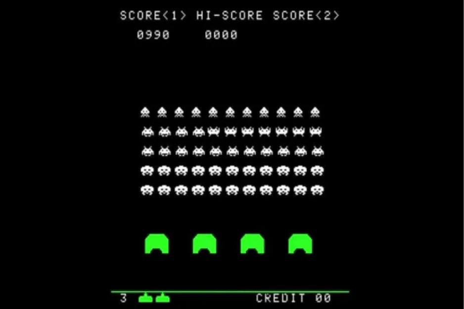 Space Invaders arcade game screen from 1972 showing pixelated alien rows and a player cannon at the bottom.