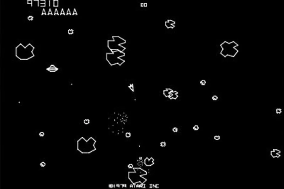 Screen capture of the arcade game Asteroids showing a spaceship shooting at multiple asteroids in space.
