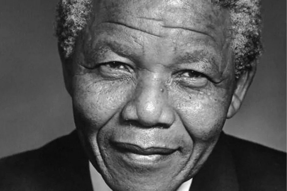 Close-up black and white portrait of Nelson Mandela, known for humanitarian work and Nobel Peace Prize recognition.