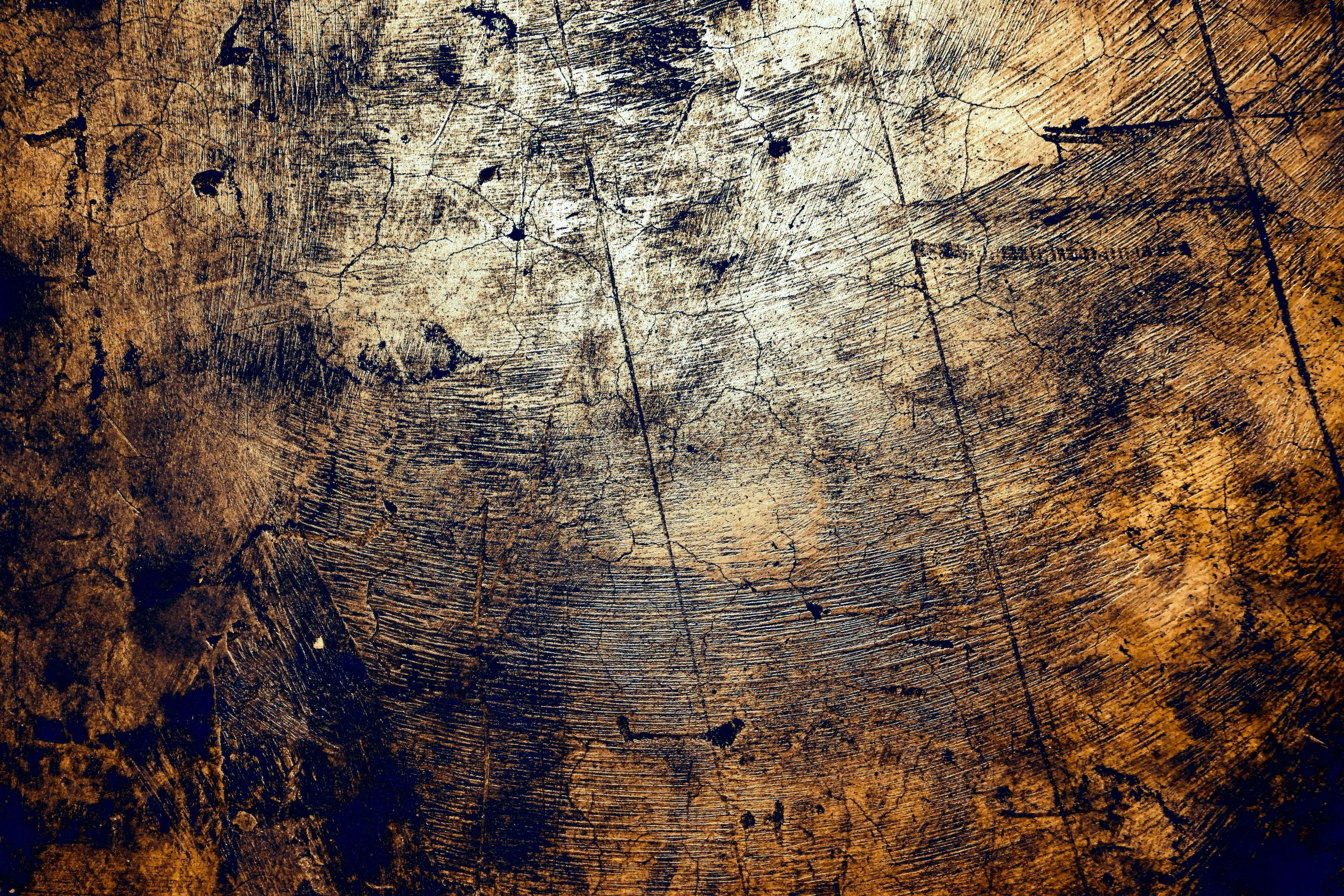Close-up of a scratched and oxidized metal surface showing corrosion, illustrating particle loss during oxidation in science.