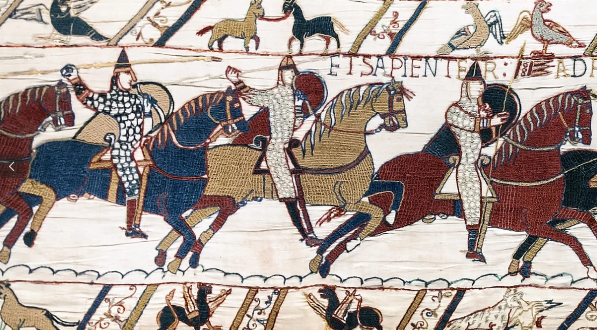 Medieval embroidered depiction of knights on horseback illustrating the Battle of Hastings from the 11th century.