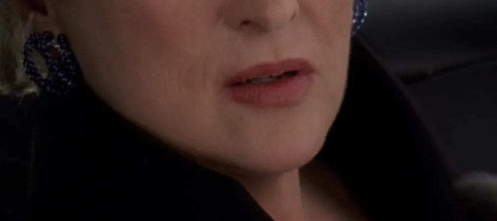 Close-up of a celebrity mouth showing teeth and lips, part of a guess the celebrity from their mouth challenge.