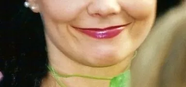 Close-up of a celebrity’s mouth with glossy pink lipstick, part of a guessing game featuring famous faces.