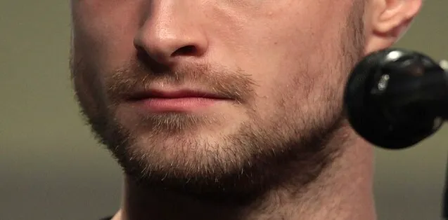 Close-up of a male mouth and beard, part of a celebrity guessing game focusing on identifying from their mouth.