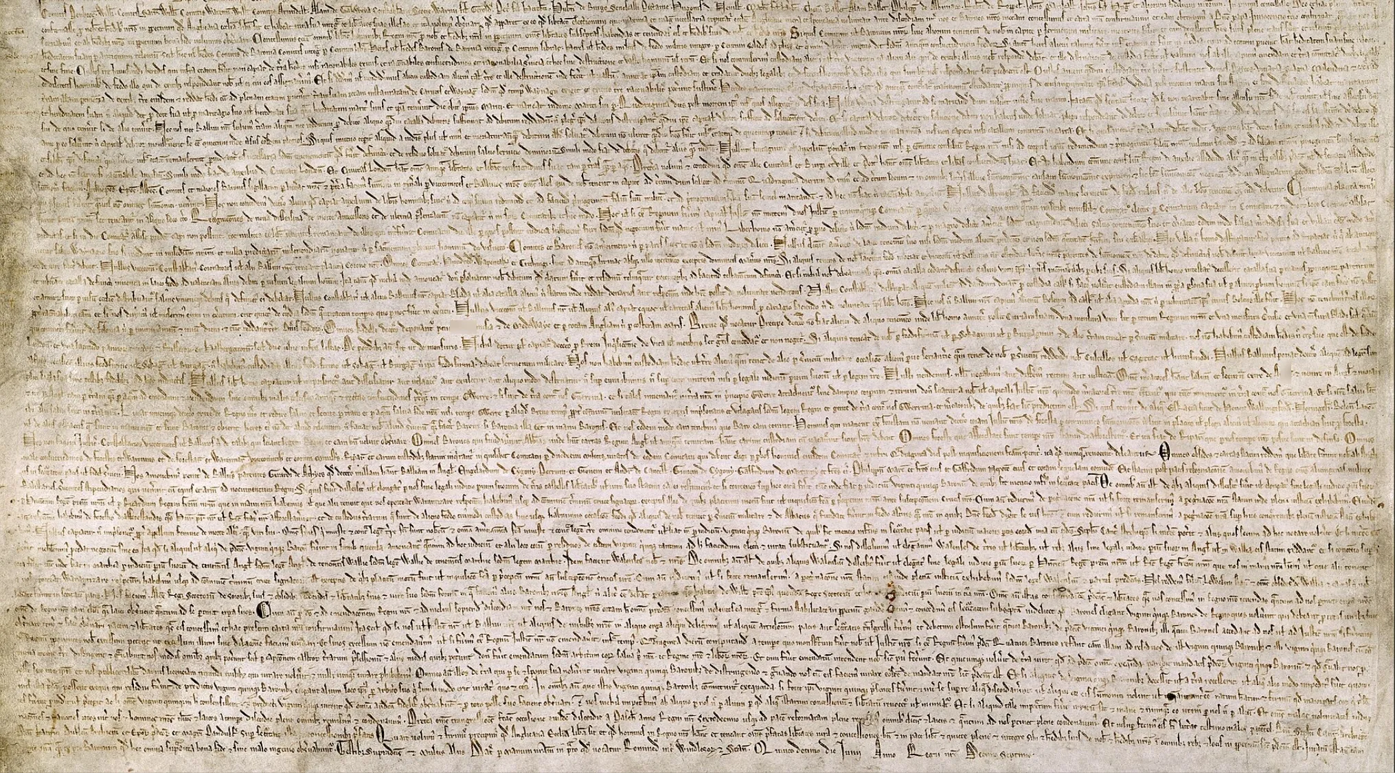 Magna Carta parchment from 1215, a historical document establishing legal rights and limiting royal power.