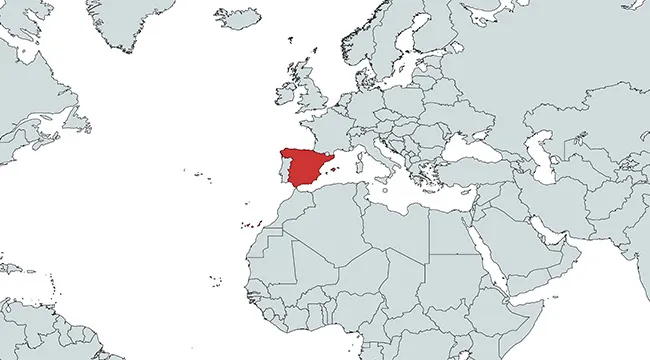 Map highlighting the country of Spain in red within the context of Europe and surrounding regions.