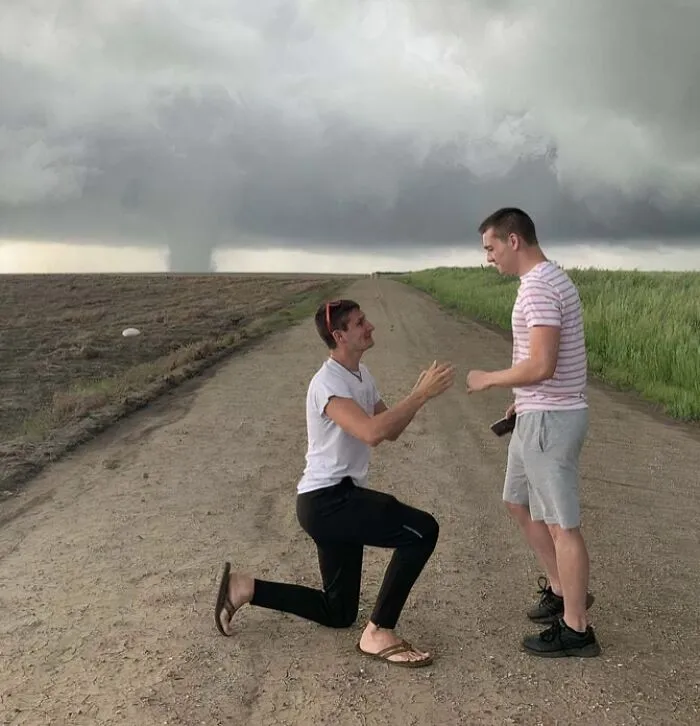 Storm Chaser Proposed With Kansas Tornado In The Background