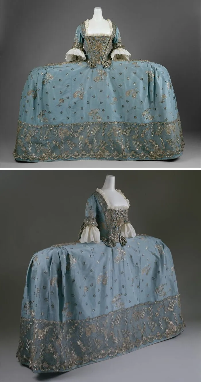 18th century blue historical garment with wide skirt and intricate gold embroidery displayed on mannequin