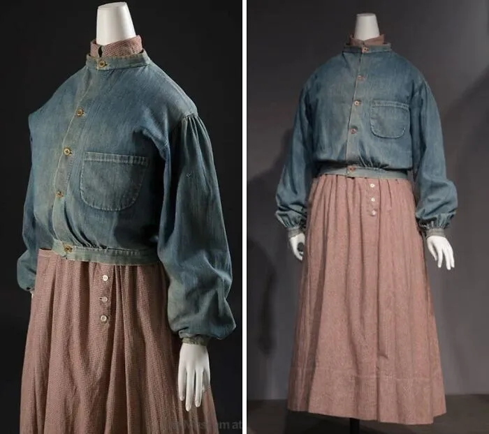 Vintage historical garment with denim blouse and long brown skirt displayed on a mannequin, showcasing unique period fashion.