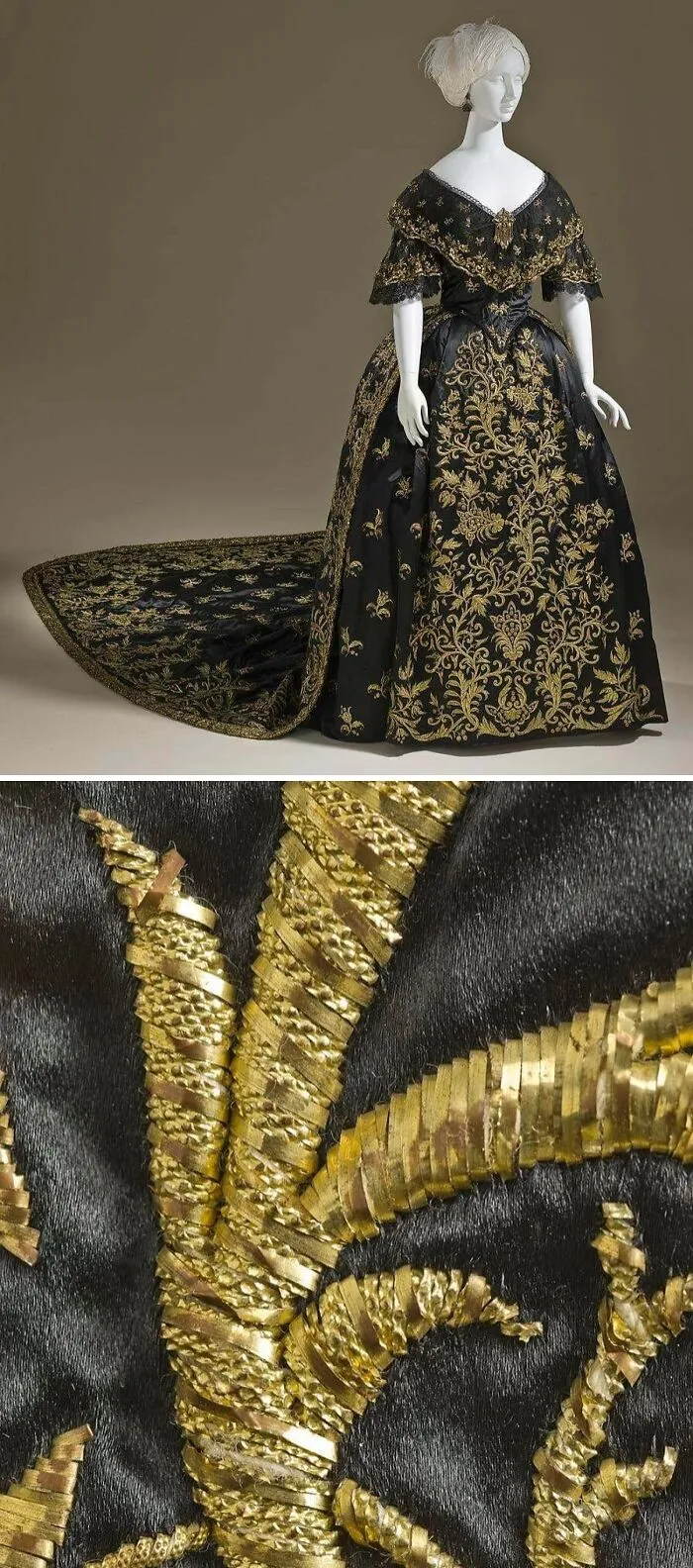 Black historical garment with intricate gold embroidery and a long train displayed on a white mannequin.