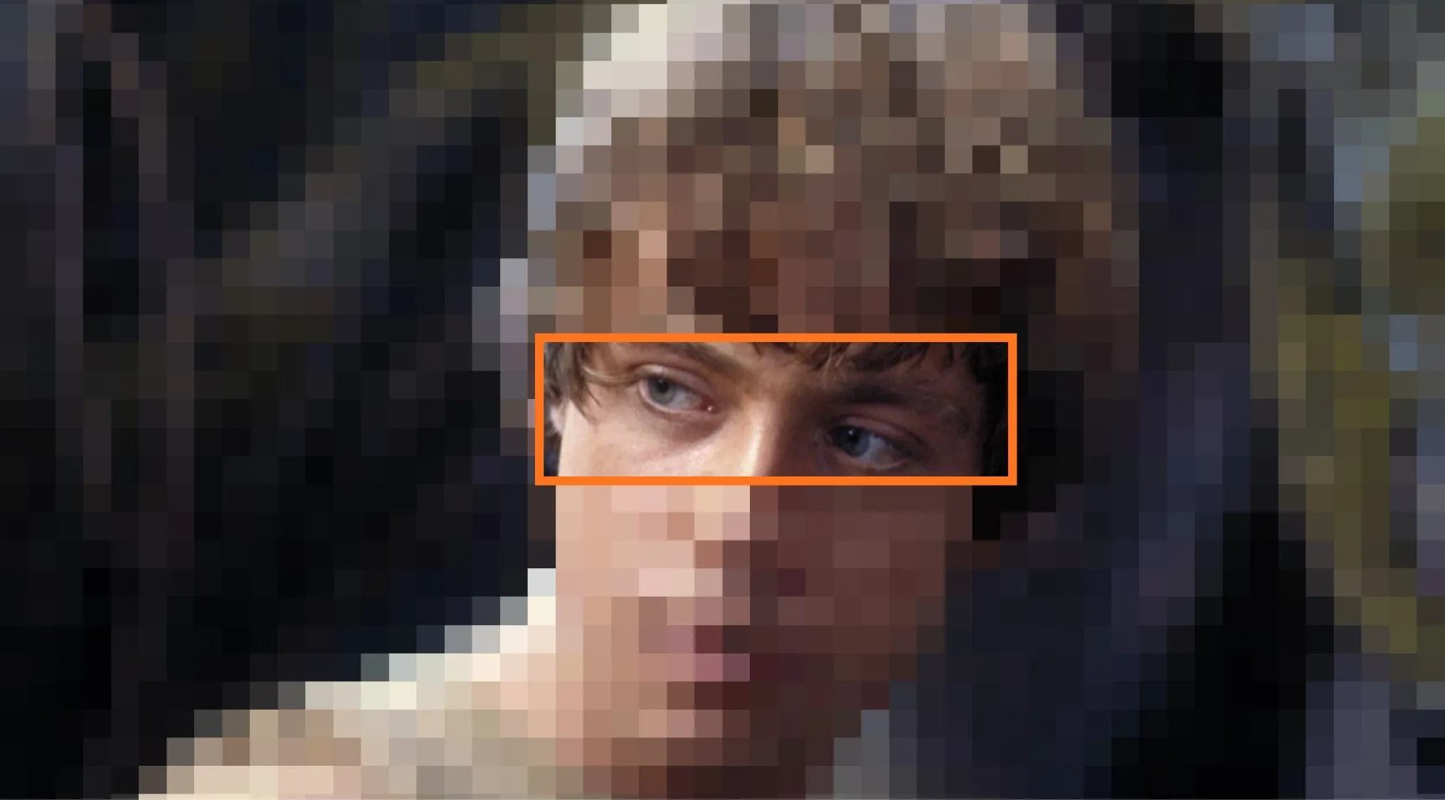 Close-up of a young man's eyes framed by an orange box, part of guessing the movie franchise from characters' eyes quiz.