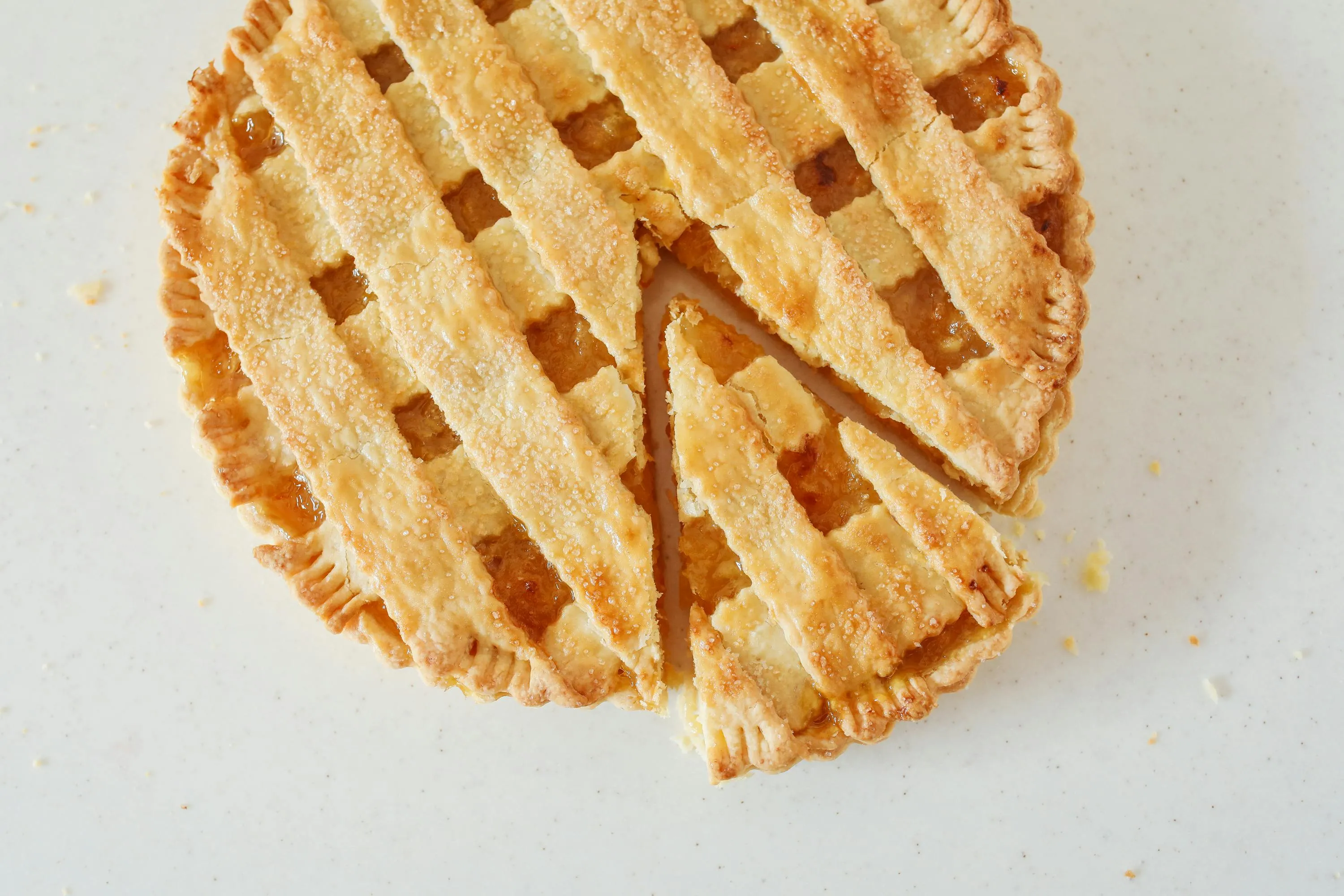 Close-up of a sliced lattice-top pie highlighting crust texture and fruit filling, illustrating differences general knowledge quiz.