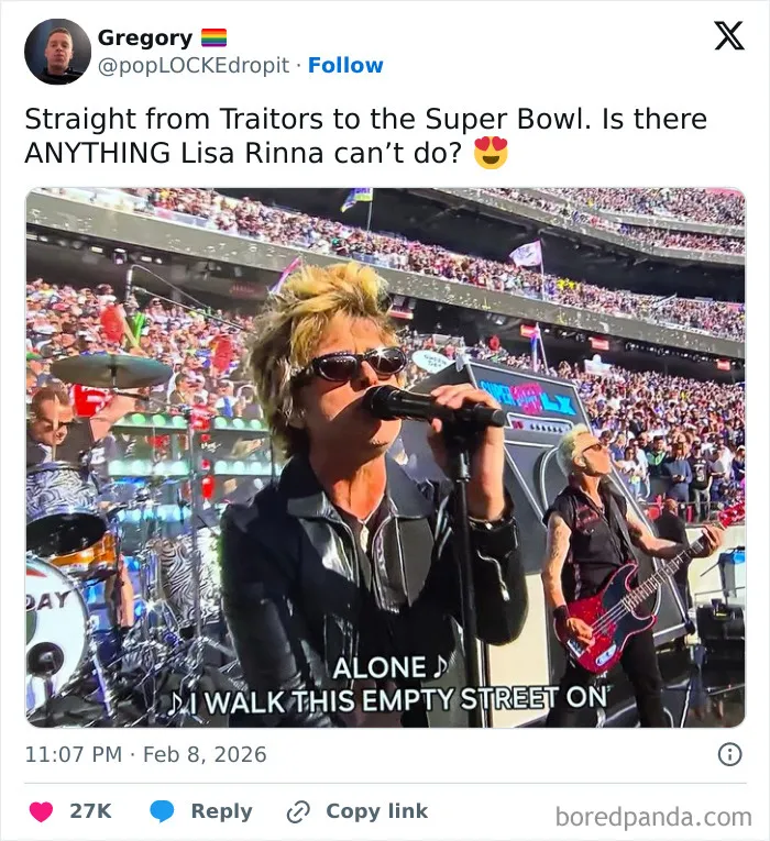 Band performing during Super Bowl LX halftime show with large crowd in stadium and on-screen song lyrics.