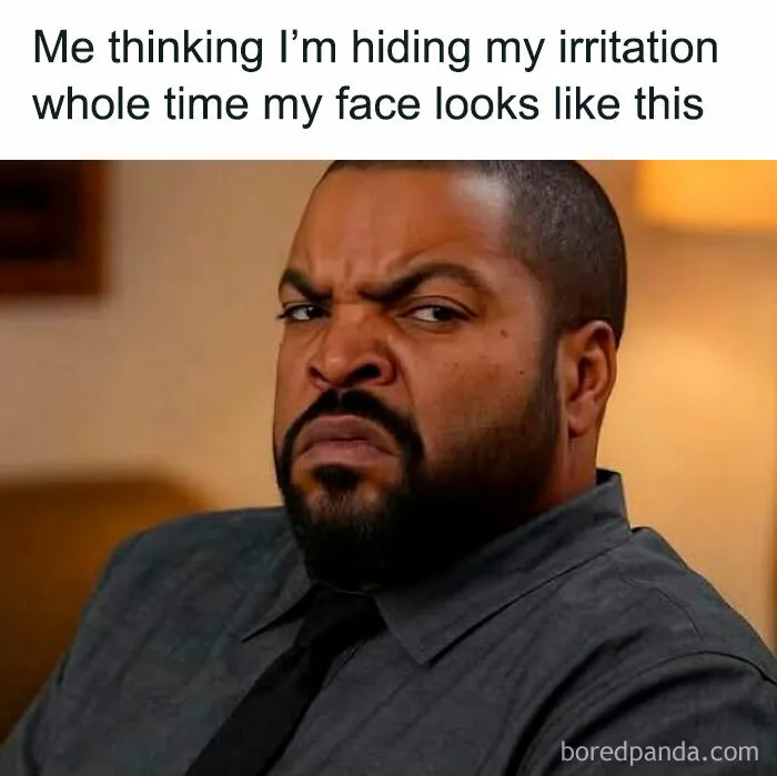 Man making an irritated face, humorously illustrating relatable memes about hiding true emotions and expressions.