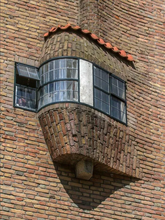The Wavy Window Of The Building On The Vrijheidslaan 50, Amsterdam. It Features This Iconic Detail Of The Amsterdam School