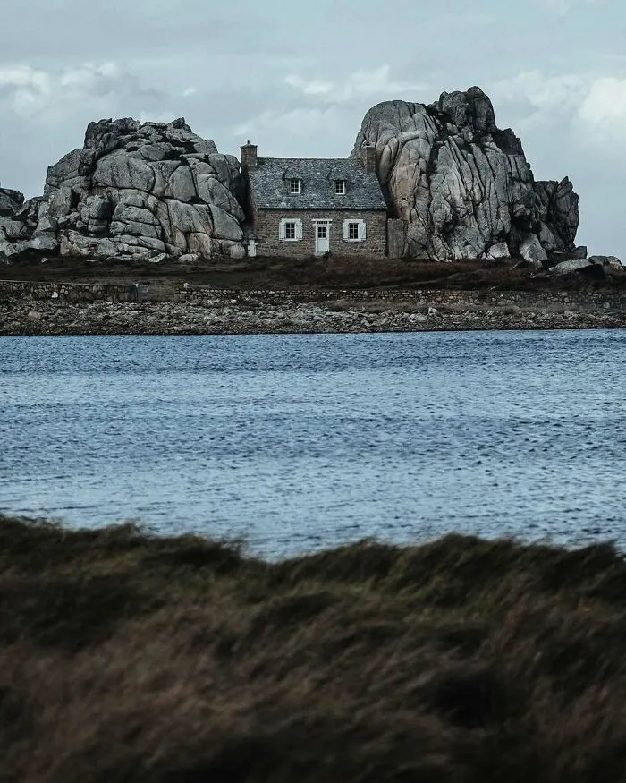 “The House Between The Rocks”, Originally Built In 1861 In The Coastal Village Of Plougrescant, Cote De Granit Rose, Brittany, France