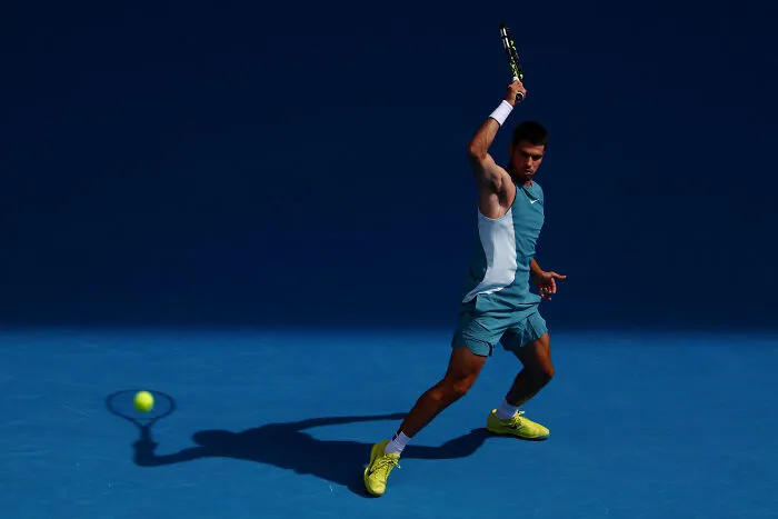 Tennis, Gold: Carlos' Shadow Hits A Ball By Edgar Su