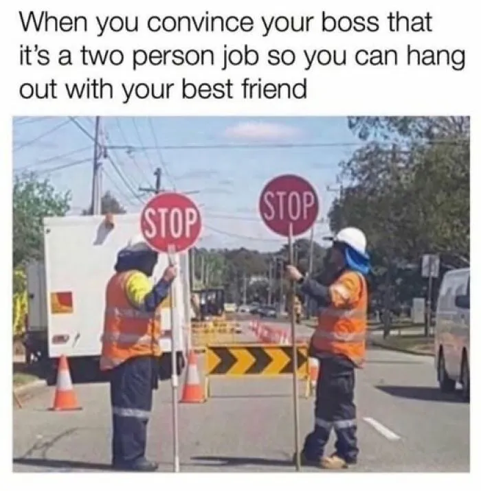 Two construction workers holding stop signs side by side as a funny meme to lighten your mood.