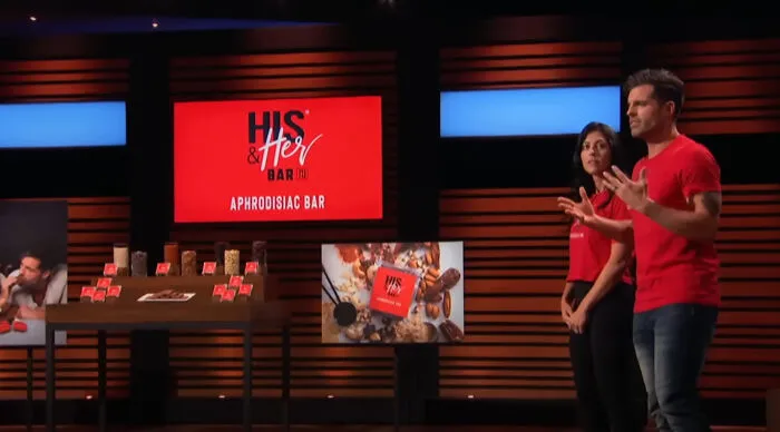 The His and Her Bar was an aphrodisiac-themed snack bar pitched by Jennifer and Michael Gallagher in Season 12. The product was a vegan, gluten-free bar made with ingredients like maca root, cayenne pepper, and chocolate, designed to boost libido and foster connection between couples. 