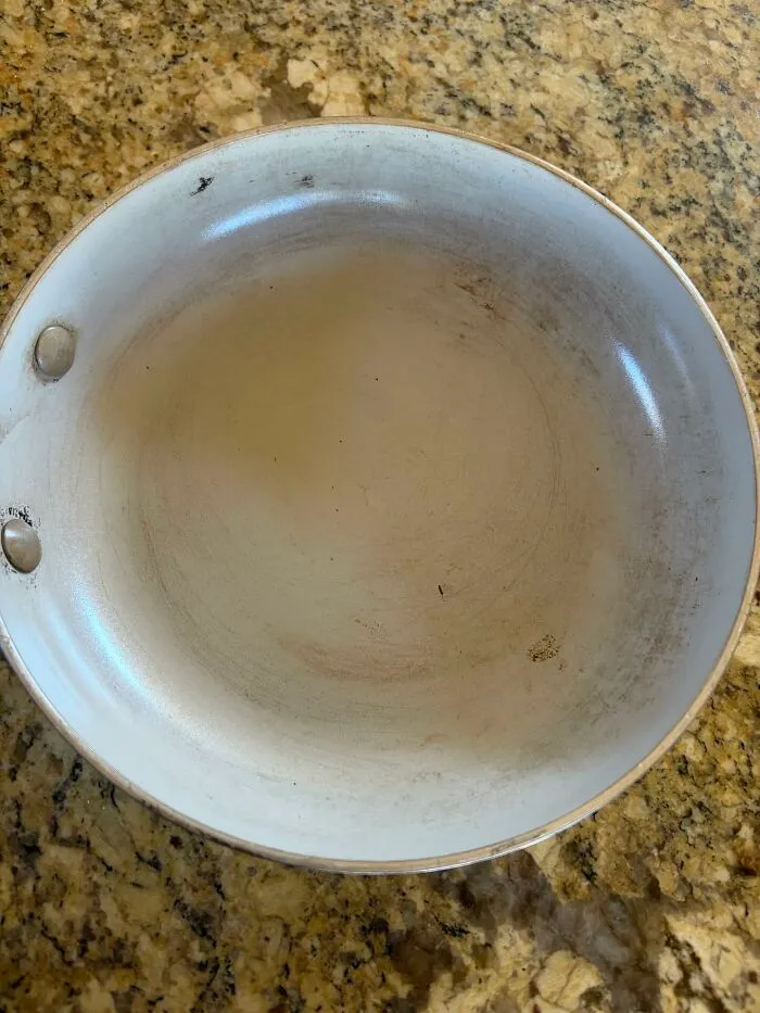 My Green Pan After I Returned From A Trip. After I Told Him So Many Times Not To Use High Heat. Or Metal Utensils. And Wait Until It Cools To Put It In The Sink