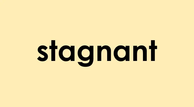 The word stagnant displayed in bold black text on a light yellow background representing stagnation concept.