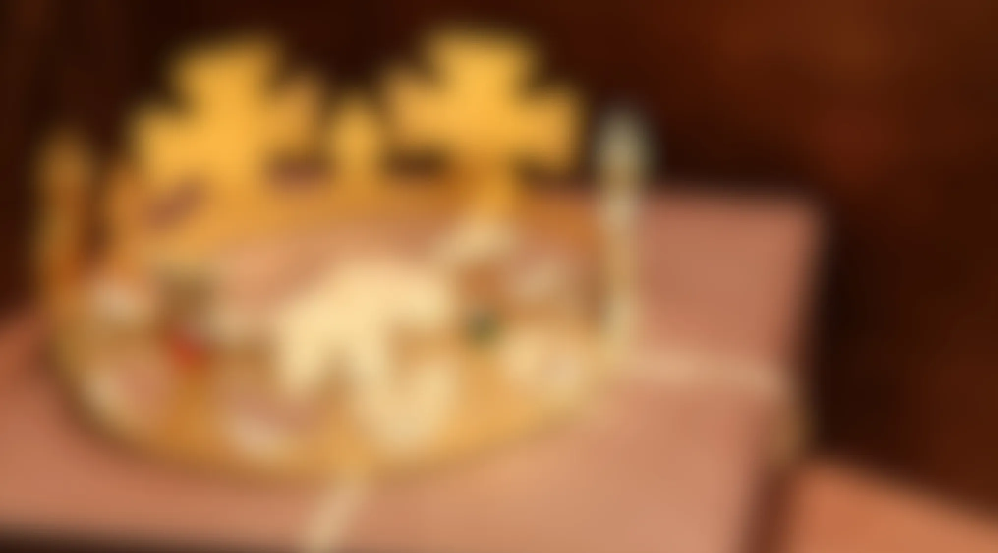 Blurry images showing an indistinct object on a surface with warm tones and soft lighting in the background