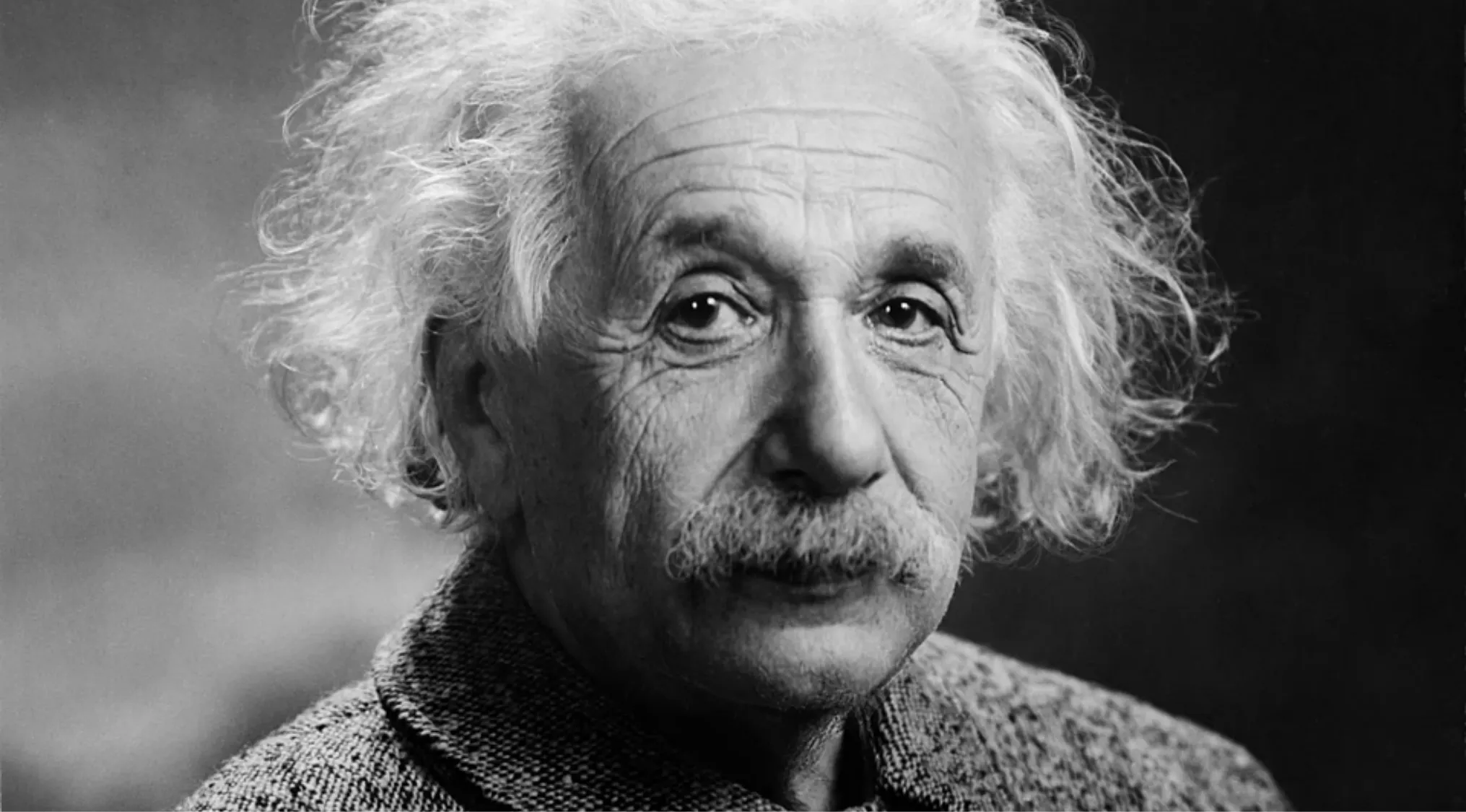 Black and white portrait of a famous person with white hair and mustache, related to identifying famous people quiz.