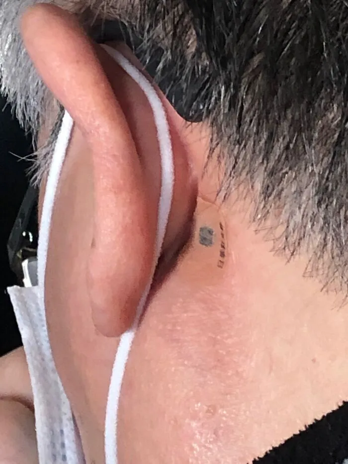 A Friend Of Mine Was Recently On A Flight Sitting Next To A Family All Wearing Face Masks And These Things Behind Their Ears... Can Anyone ID It?