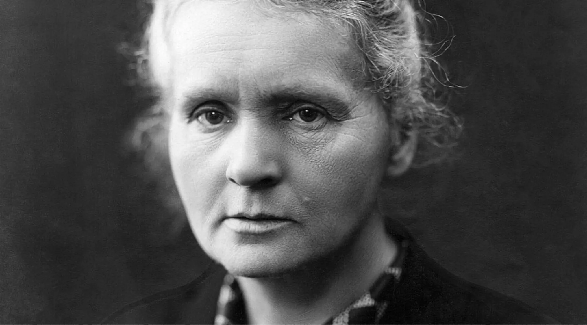 Black and white portrait of a famous person, showing detailed facial features for identification of first and last name.