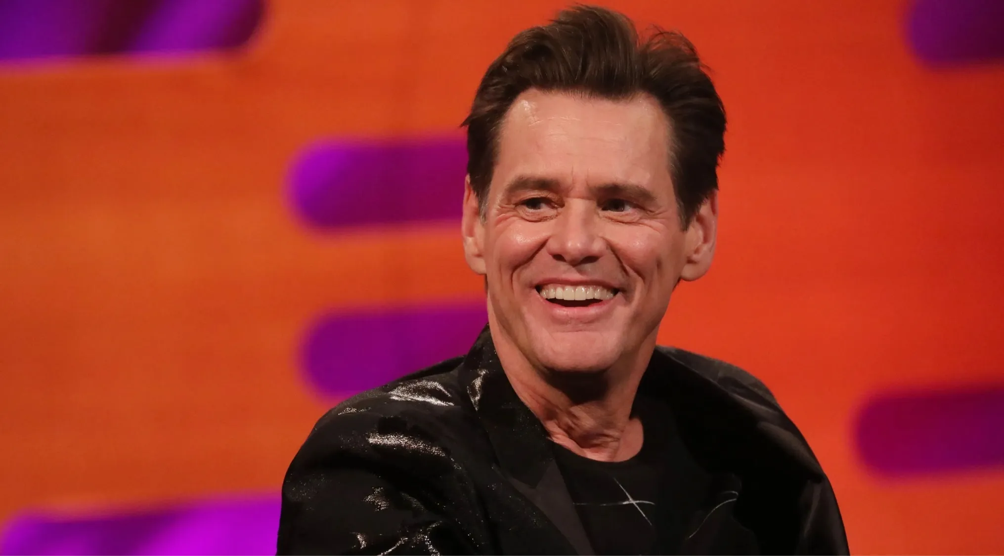 Famous actor smiling in black jacket during a talk show, can you identify this actor among famous people quiz.