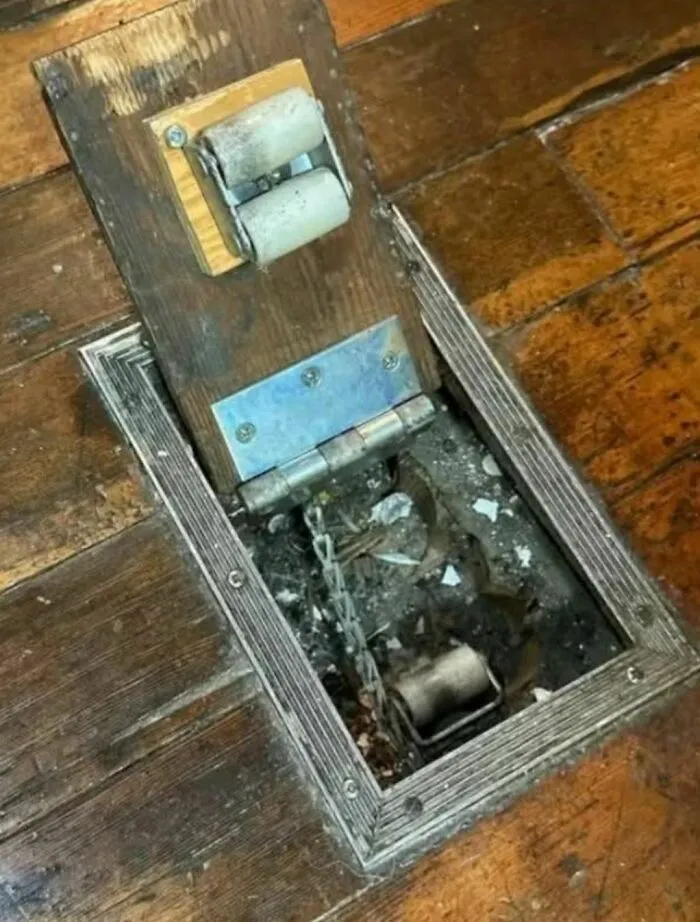 Old House Mystery. What Is This Mechanism In The Floor? Looks Like It Has Some Type Of Roller System...
