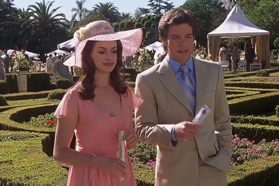 Harry and Sally characters at an outdoor garden event, dressed formally with greenery and tents in the background