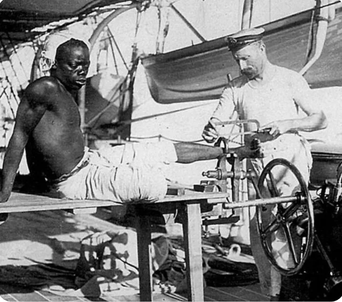 A British Blacksmith On Hms Sphinx Removing The Leg Irons, 1907
