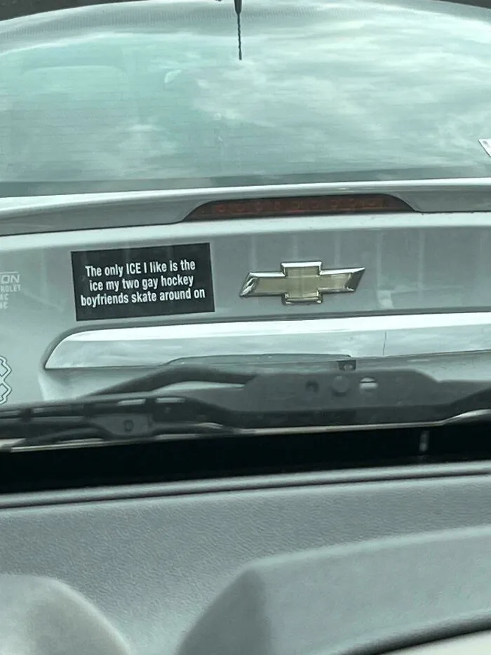 An unfiltered bumper sticker on a car that reads The only ICE I like is the ice my two gay hockey boyfriends skate around on.