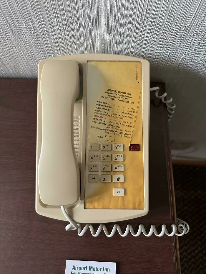 The Sun Damage On This Motel Telephone Avoids The Shadow Of The Phone Itself